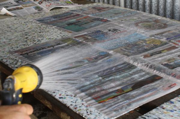 Wetting newspaper